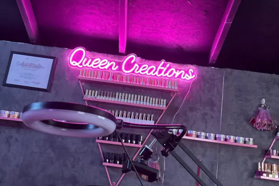 Custom neon salon sign on a studio wall