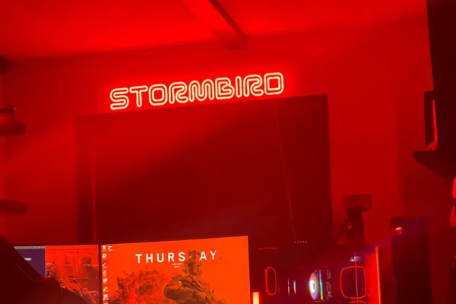 Red neon brand sign above a bar counter